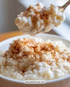 Bowl of creamy old-fashioned stovetop rice pudding topped with cinnamon