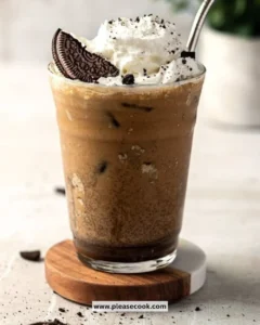 Delicious Oreo Iced Coffee topped with whipped cream and crushed Oreos