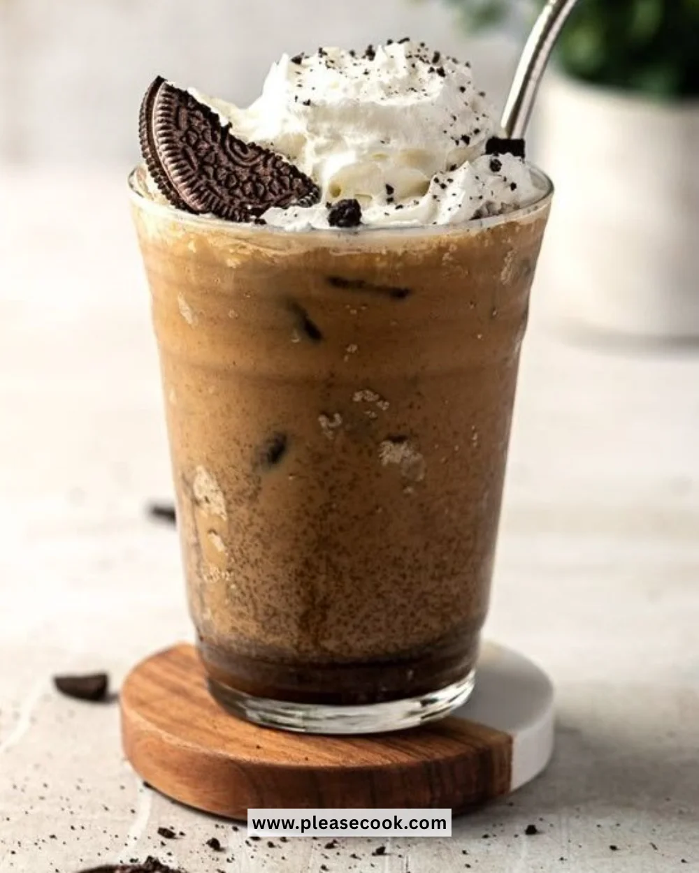 Delicious Oreo Iced Coffee topped with whipped cream and crushed Oreos