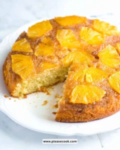 Delicious and moist pineapple cake with cream frosting on a plate.
