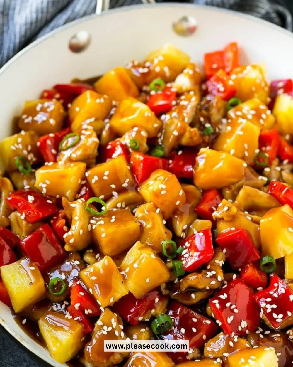 Delicious Pineapple Chicken served on a plate with vibrant vegetables.