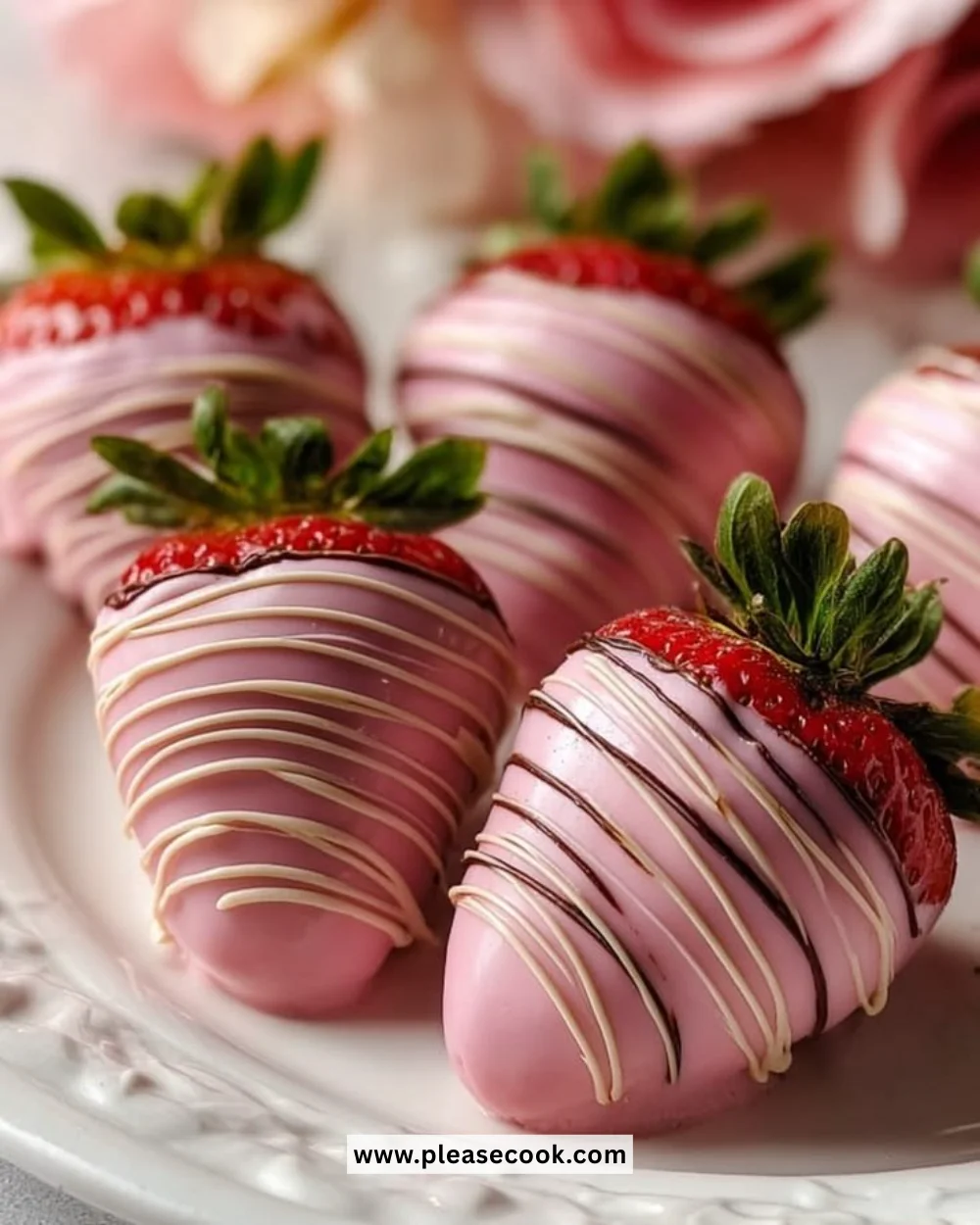 Pink chocolate covered strawberries garnished for a delightful presentation.