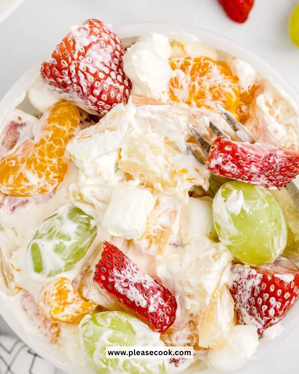 Delicious pudding fruit salad with mixed fresh fruits and creamy pudding