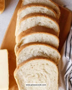 Homemade sandwich bread fresh from the oven with golden crust and soft interior.