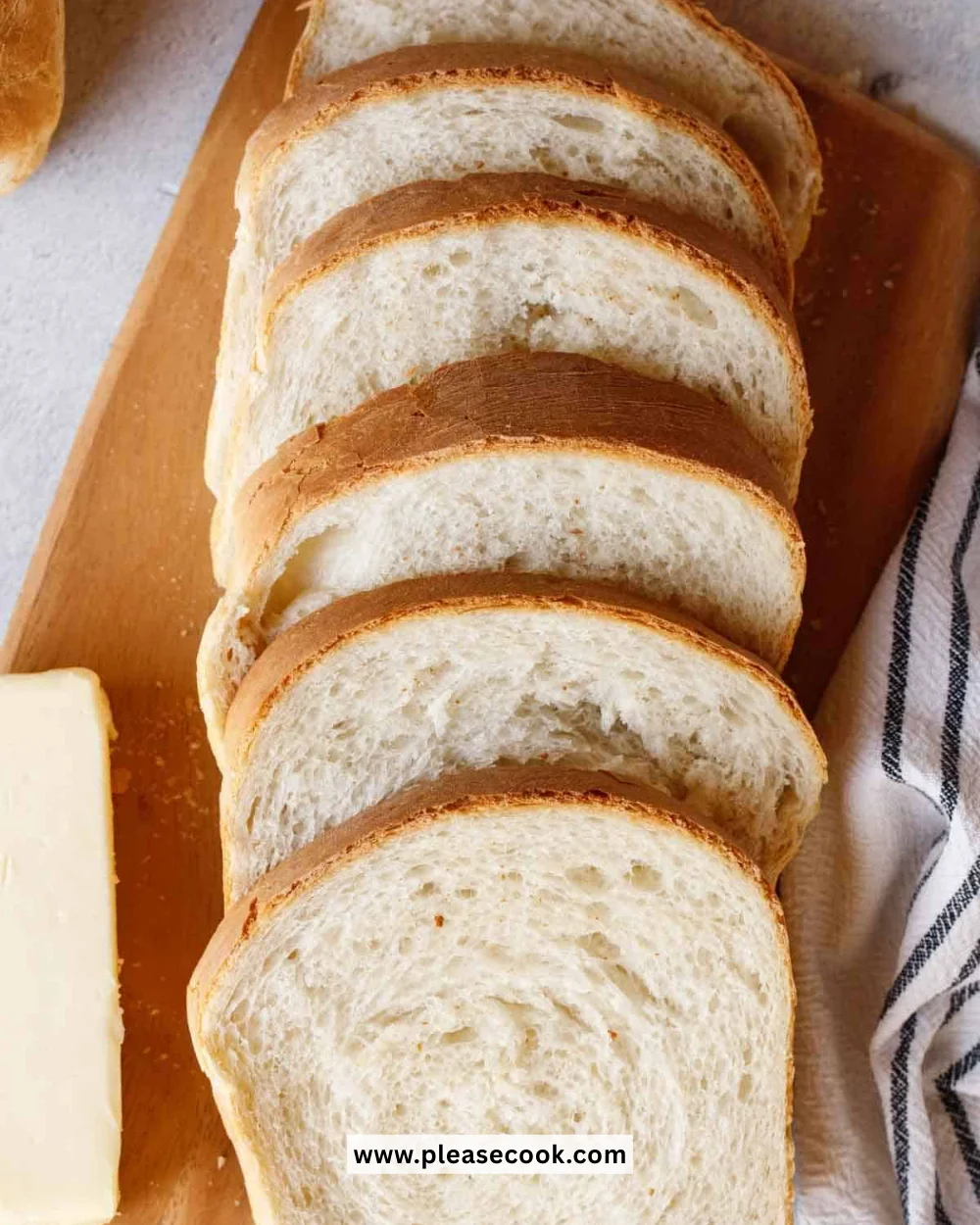 Homemade sandwich bread fresh from the oven with golden crust and soft interior.
