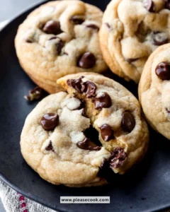 Freshly baked soft chocolate chip cookies on a cooling rack