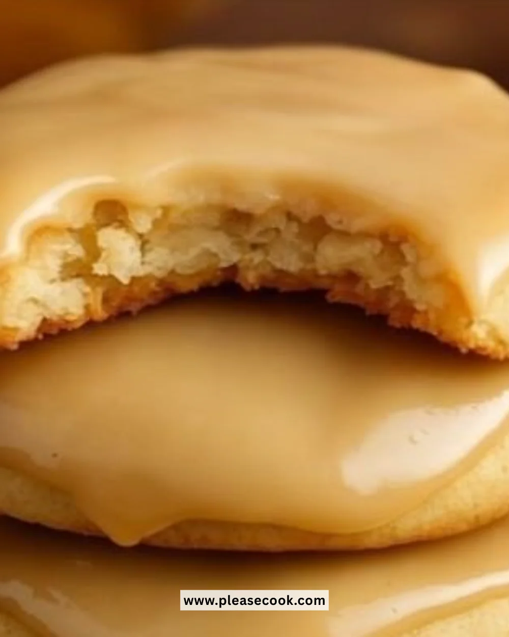 Soft maple cookies drizzled with brown butter icing on a plate