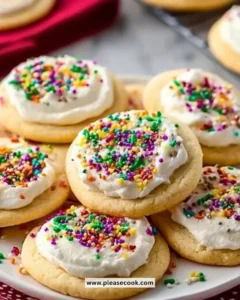 Freshly baked sour cream sugar cookies arranged on a cooling rack