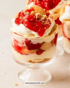 Delicious Strawberry Banana Pudding in a glass bowl with fresh strawberries and bananas