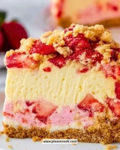 Slice of Strawberry Cheesecake Crunch topped with fresh strawberries and graham cracker crust