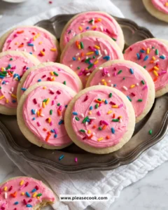 Different colors of sugar cookie frosting on decorated sugar cookies
