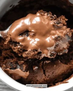 Delicious chocolate mug cake topped with chocolate sprinkles in a mug