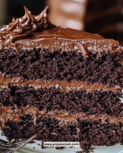 Delicious slice of Matilda Chocolate Cake with rich frosting and sprinkles