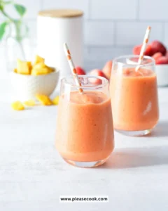 Vibrant Tropical Smoothie Sunrise Sunset with fresh fruits and tropical elements.