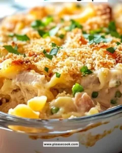 Baked Tuna Noodle Casserole topped with breadcrumbs and cheese, ready to serve.