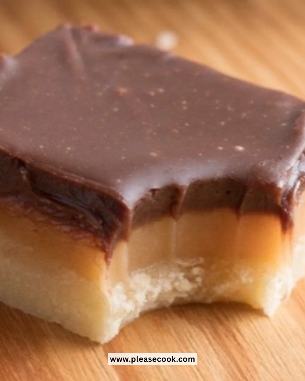 Delicious homemade Twix Cookie Bars with layers of cookie, caramel, and chocolate