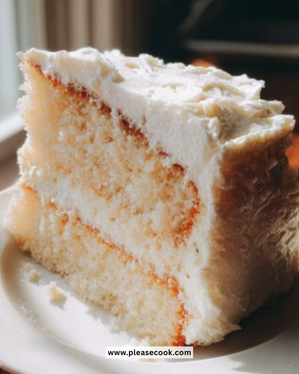 Delicious vanilla layer cake with white frosting and fresh berries on top