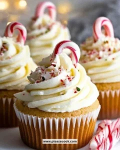 Delicious white chocolate peppermint cupcakes topped with festive sprinkles.