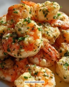 Crispy air fryer shrimp served on a plate with lemon and herbs