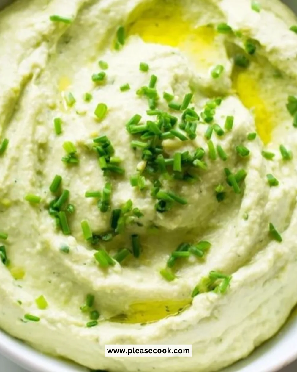 Healthy avocado cottage cheese blend served in a bowl with herbs