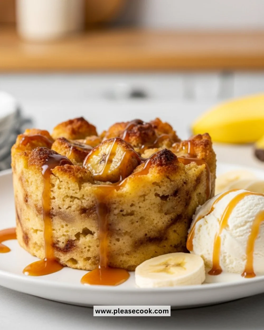 Delicious homemade banana bread pudding topped with caramel sauce.