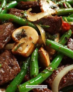 Stir-fried black pepper beef with mushrooms and green beans in a savory sauce
