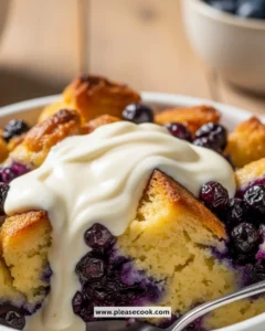 Delicious blueberry bread pudding served with creamy crème anglaise