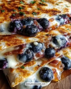 Blueberry breakfast quesadilla with melted cheese and fresh blueberries