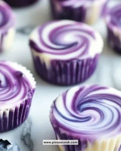 Blueberry swirl yogurt bites in a bowl, showcasing vibrant blueberries and creamy yogurt.