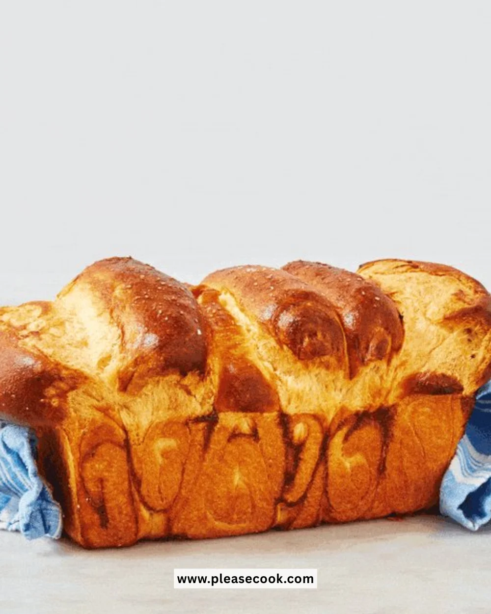 Freshly baked brioche bread with a golden crust and soft texture.
