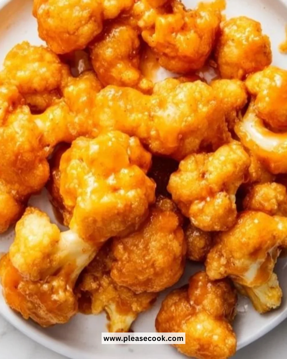 A plate of crispy Buffalo Cauliflower Bites with dipping sauce