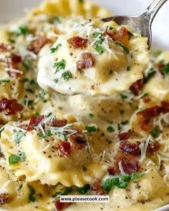 Plate of Carbonara Ravioli topped with cheese and herbs
