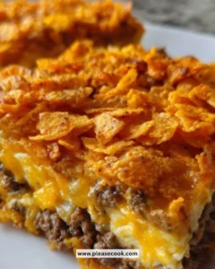 Delicious cheesy taco casserole topped with melted cheese and fresh toppings