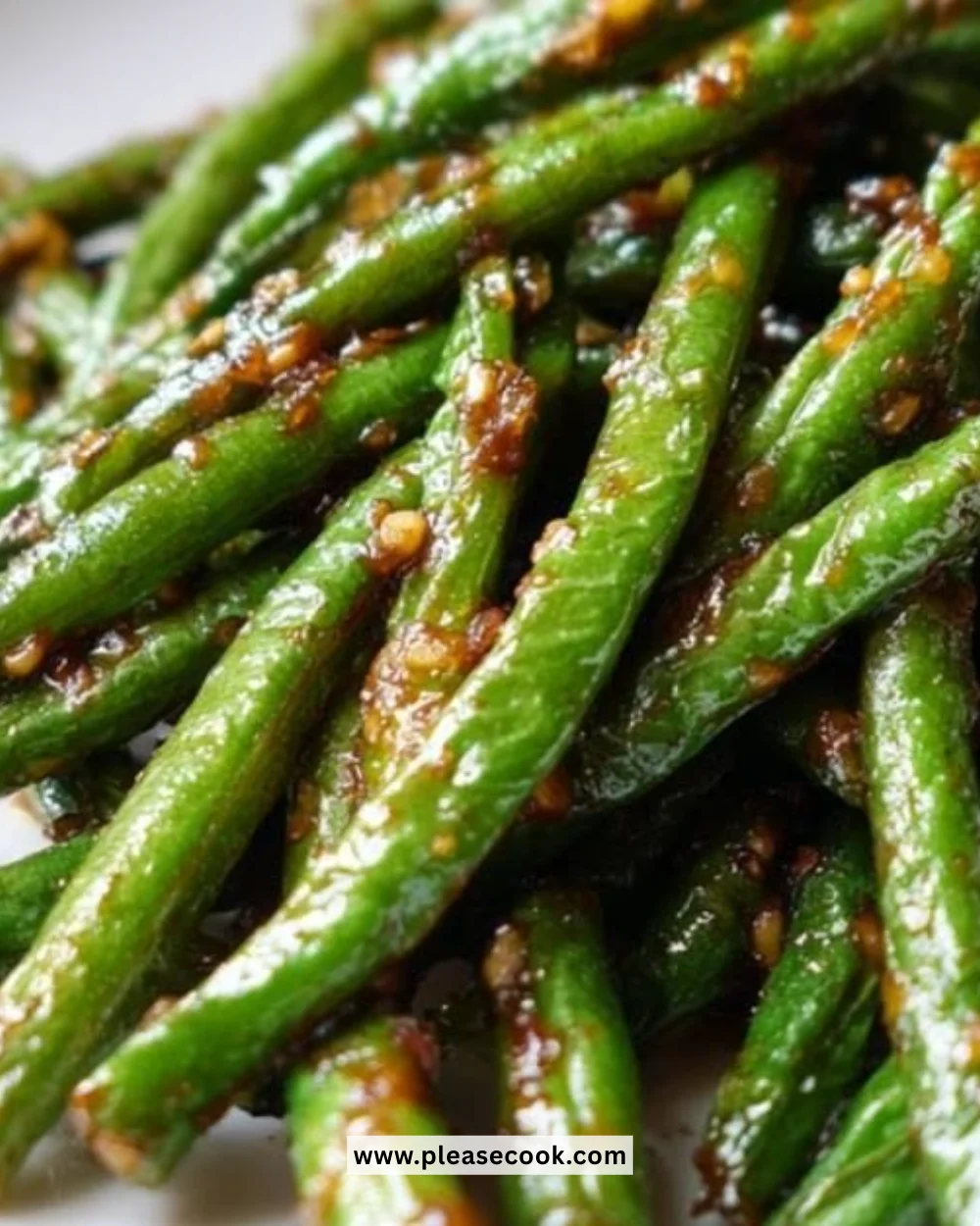 Chinese green beans stir-fried in garlic sauce, garnished and ready to serve.