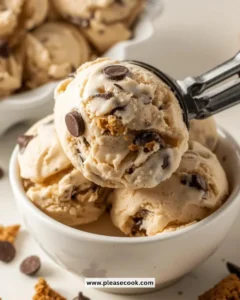 Delicious bowl of chocolate chip cookie dough ice cream with chunks of cookie dough.