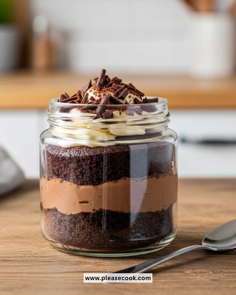 Delicious Chocolate Jar Cake served in a clear jar with chocolate layers