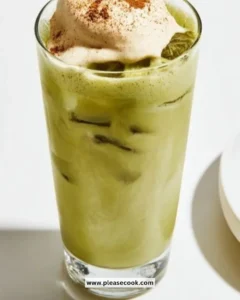 Cinnamon Roll Iced Matcha drink with swirls of cinnamon and matcha on top.