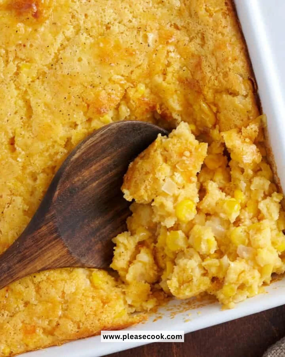 Delicious homemade cornbread casserole topped with melting cheese.