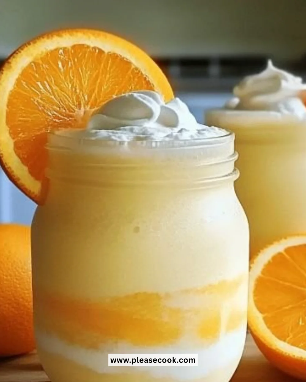 Refreshing Creamsicle Slushy made with orange and cream flavors
