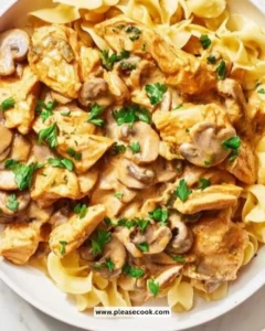 Delicious creamy Chicken Stroganoff served on a plate with pasta