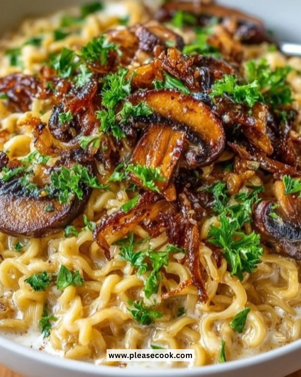 Bowl of creamy mushroom stroganoff ramen with fresh herbs and mushrooms