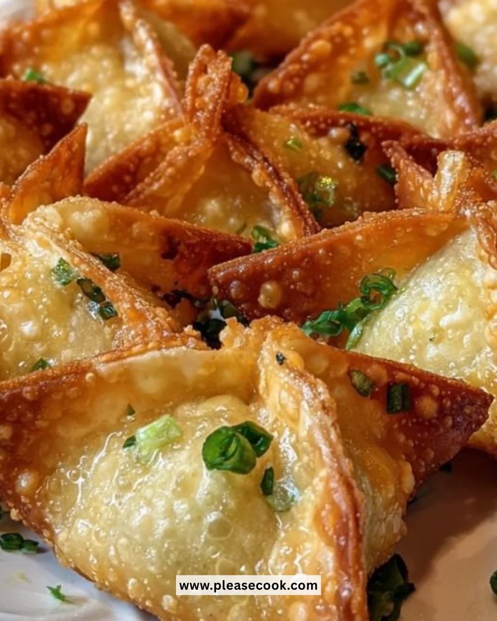 Crispy Crab Rangoon with golden-brown exterior and creamy filling on a plate