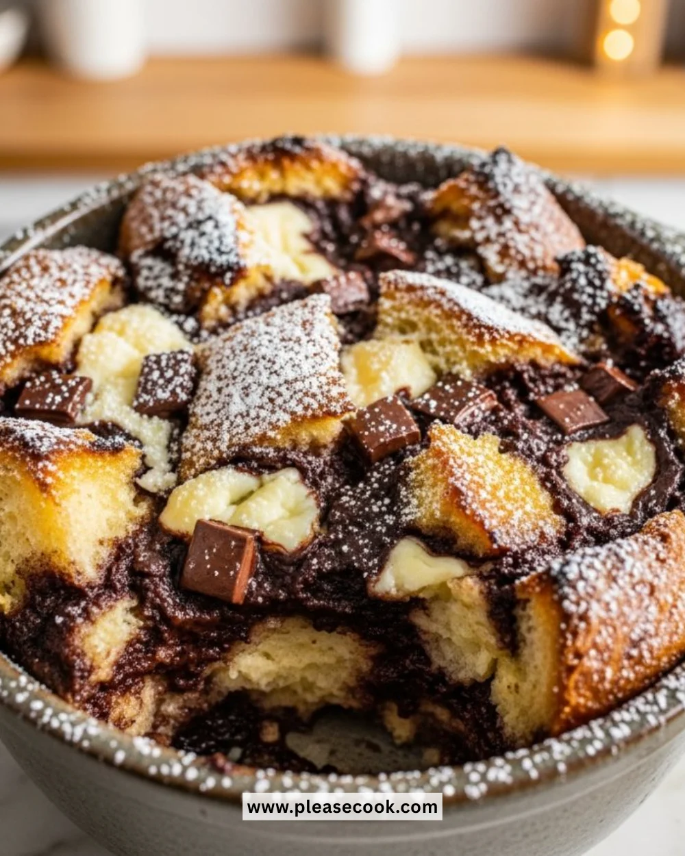 Decadent chocolate and cream cheese bread pudding dessert served in a bowl.