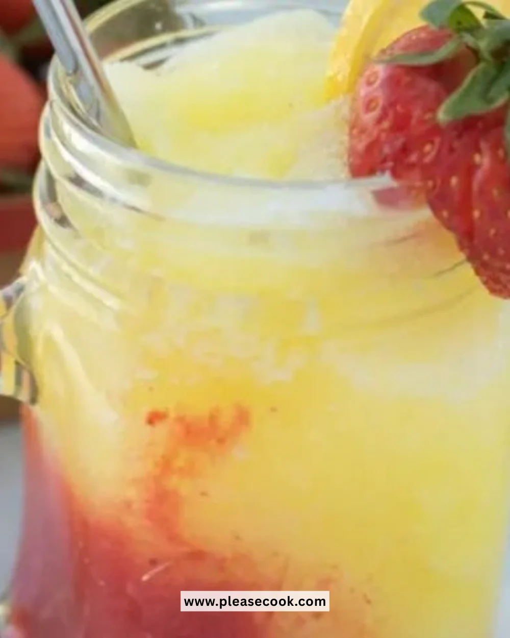 Delicious frozen strawberry lemonade served in a glass with fresh strawberries