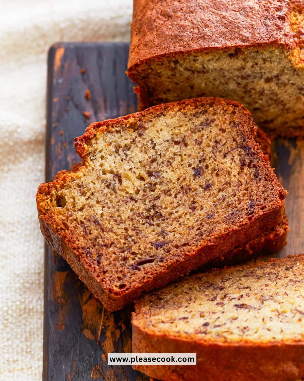 Freshly baked gluten-free banana bread on a wooden table