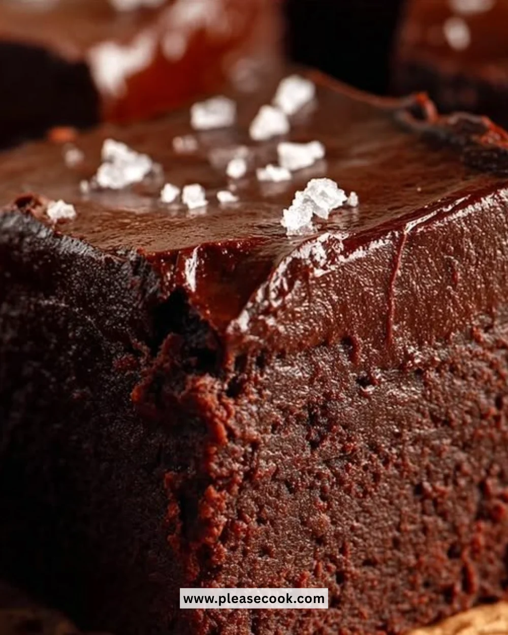 Delicious gluten-free keto avocado brownies topped with nuts and chocolate drizzle