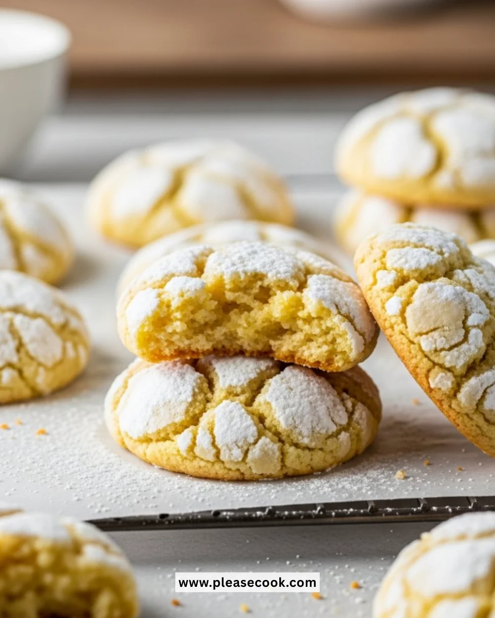 Plate of gooey butter cookies dusted with powdered sugar