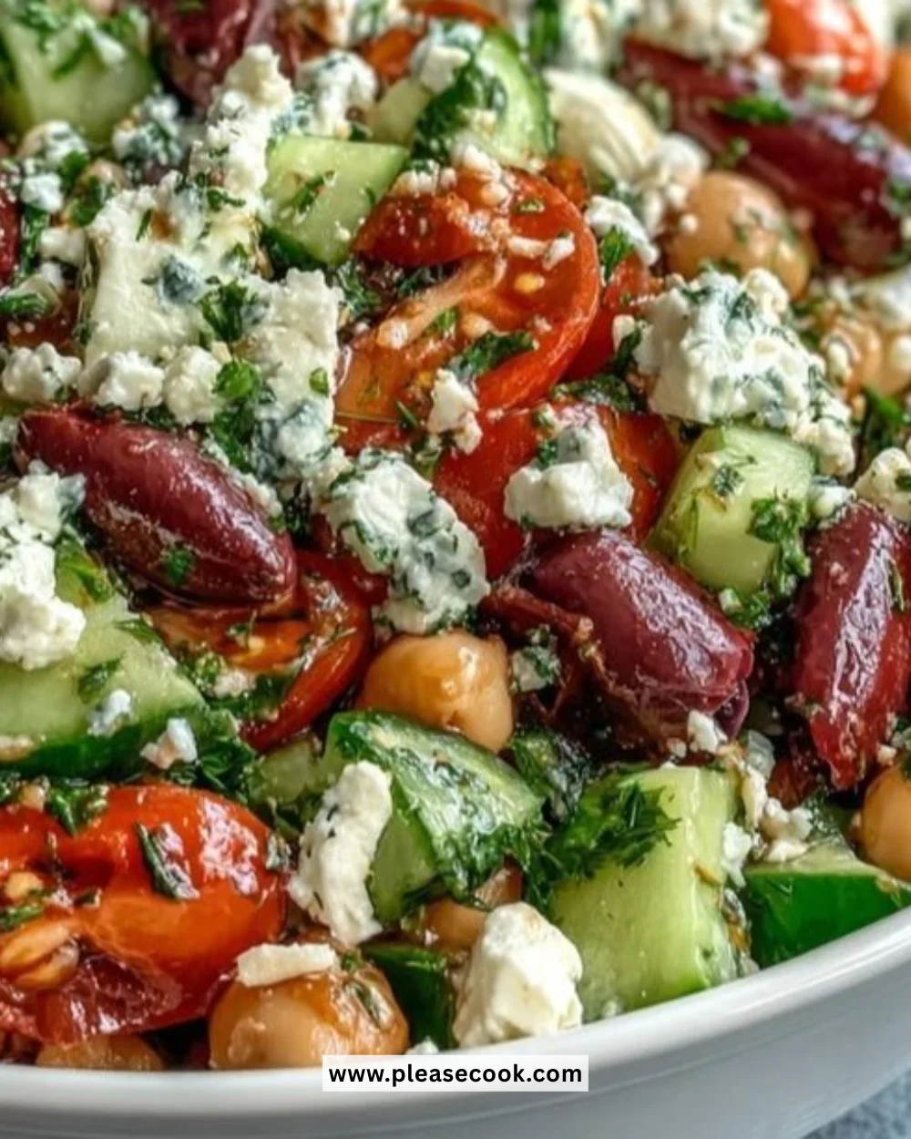 Colorful Greek Bean Salad with vegetables and herbs in a bowl