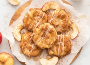 Healthy air fryer apple fritters with a golden-brown crust and apple slices