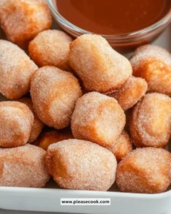 Healthy air fryer churro bites served on a plate with cinnamon sugar